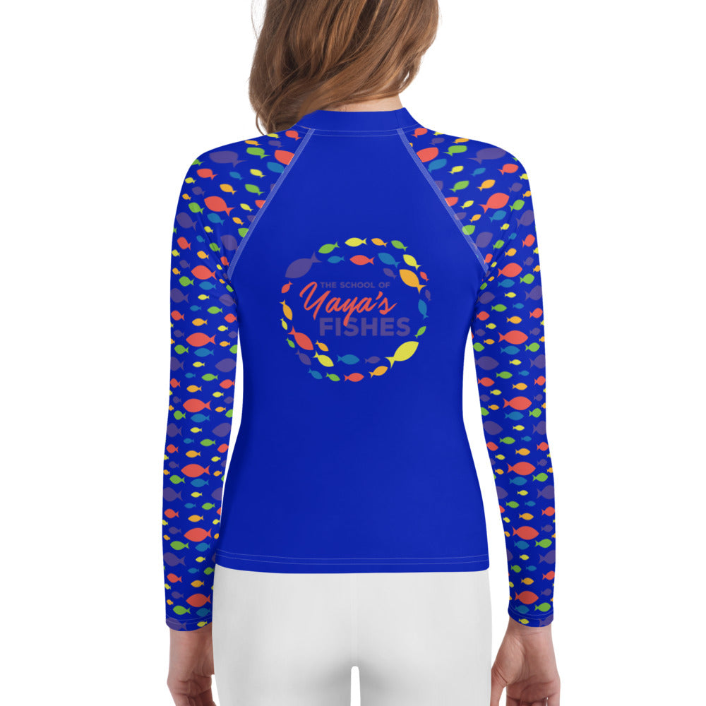 Description: Raglan rashguard in blue with The School of Yaya’s Fishes logos on front and back and Fish Print on sleeves.