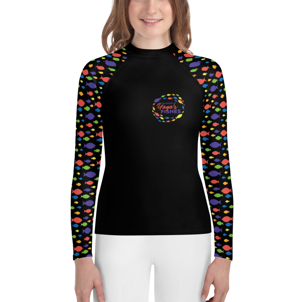 Description: Raglan rashguard in black with The School of Yaya’s Fishes logos on front and back and Fish Print on sleeves.