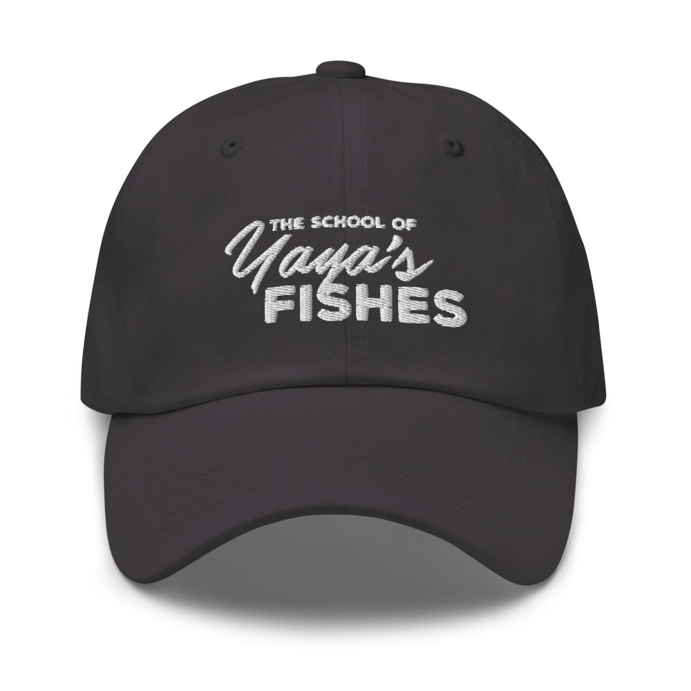 Description: Classic Dad Ball Cap in dark grey with white embroidered logo for The School of Yaya’s Fishes.