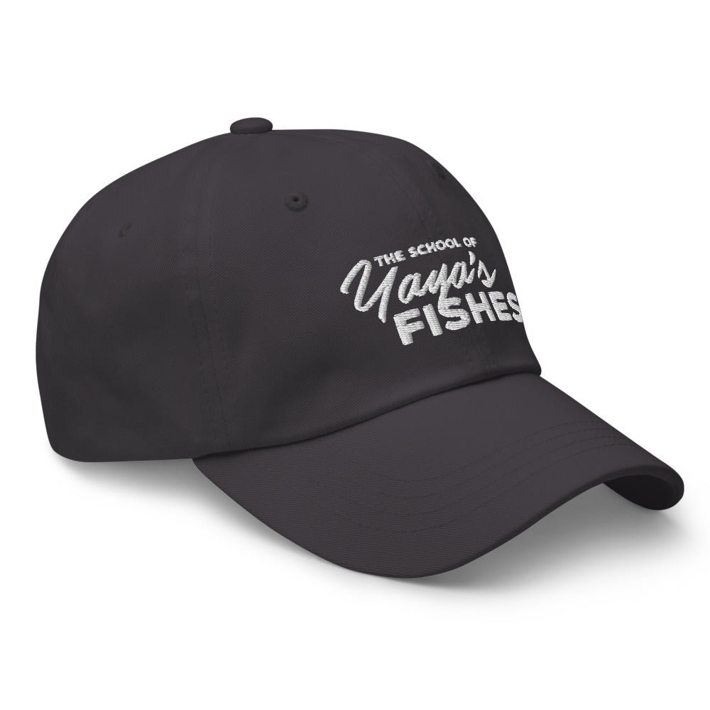 Description: Classic Dad Ball Cap in dark grey with white embroidered logo for The School of Yaya’s Fishes.