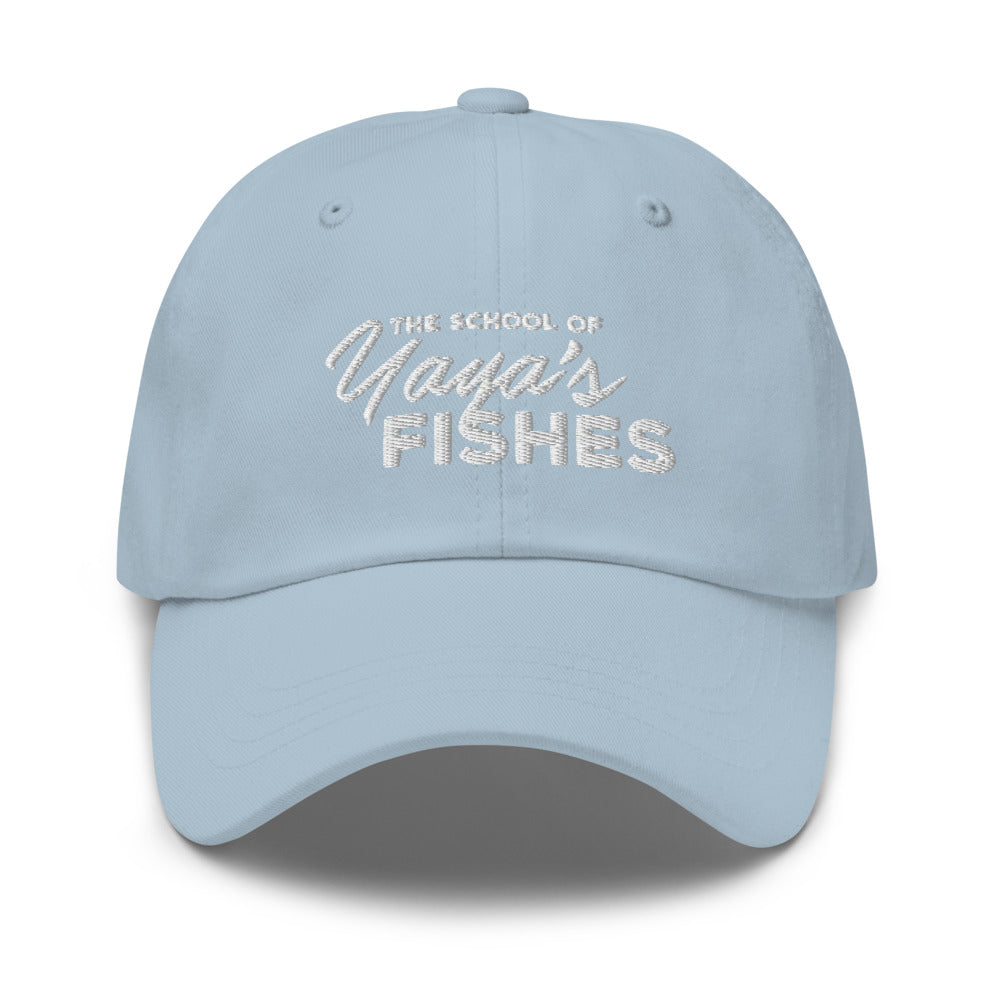 Description: Classic Dad Ball Cap in baby blue with white embroidered logo for The School of Yaya’s Fishes.