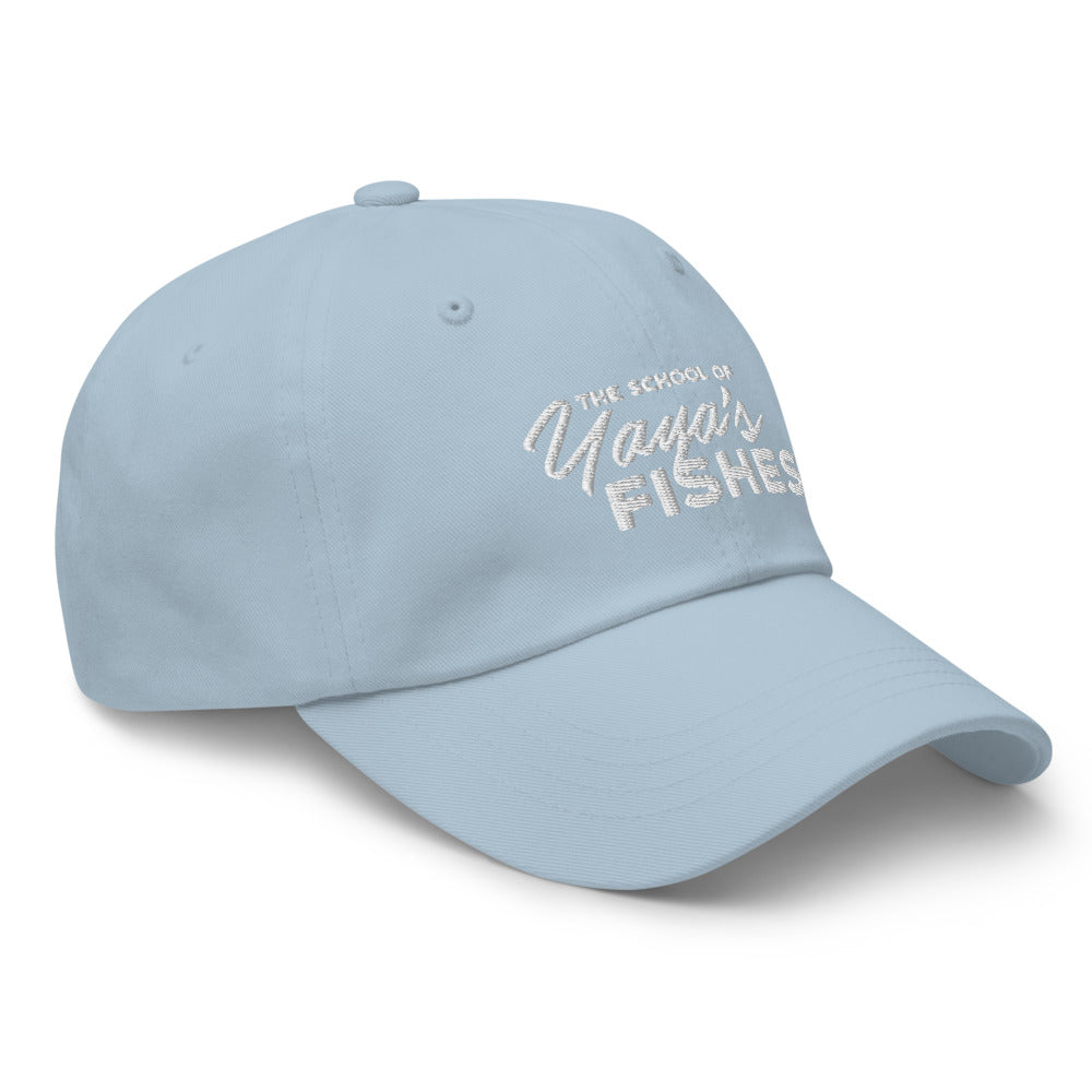 Description: Classic Dad Ball Cap in baby blue with white embroidered logo for The School of Yaya’s Fishes.