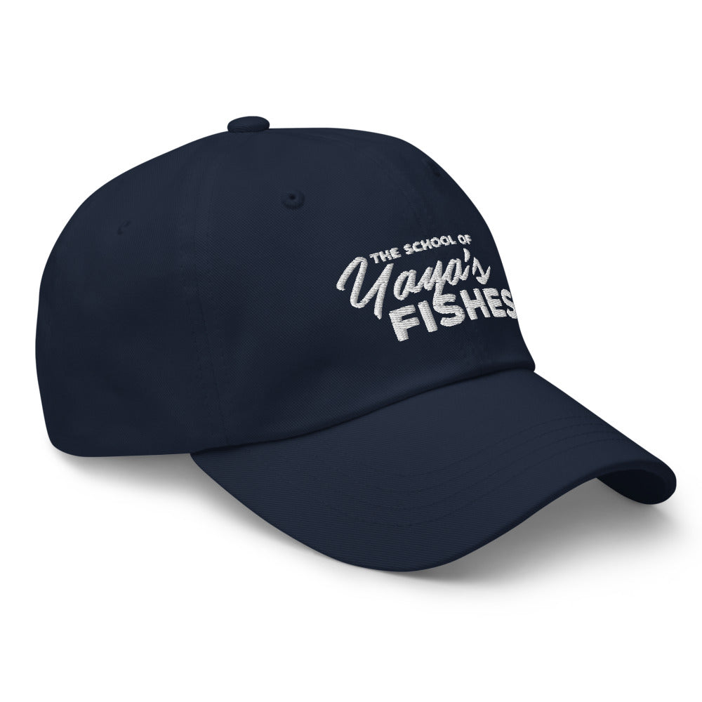 Description: Classic Dad Ball Cap in navy with white embroidered logo for The School of Yaya’s Fishes.