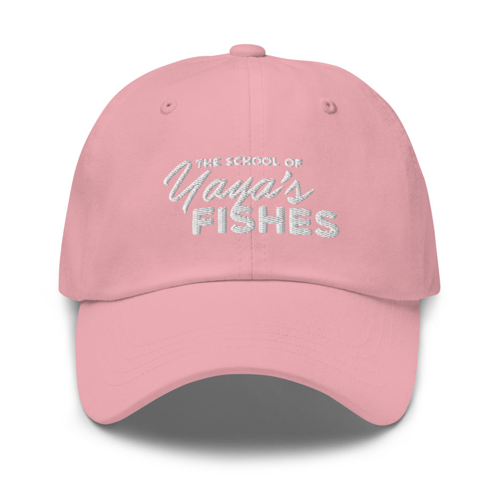 Description: Classic Dad Ball Cap in light pink with white embroidered logo for The School of Yaya’s Fishes.